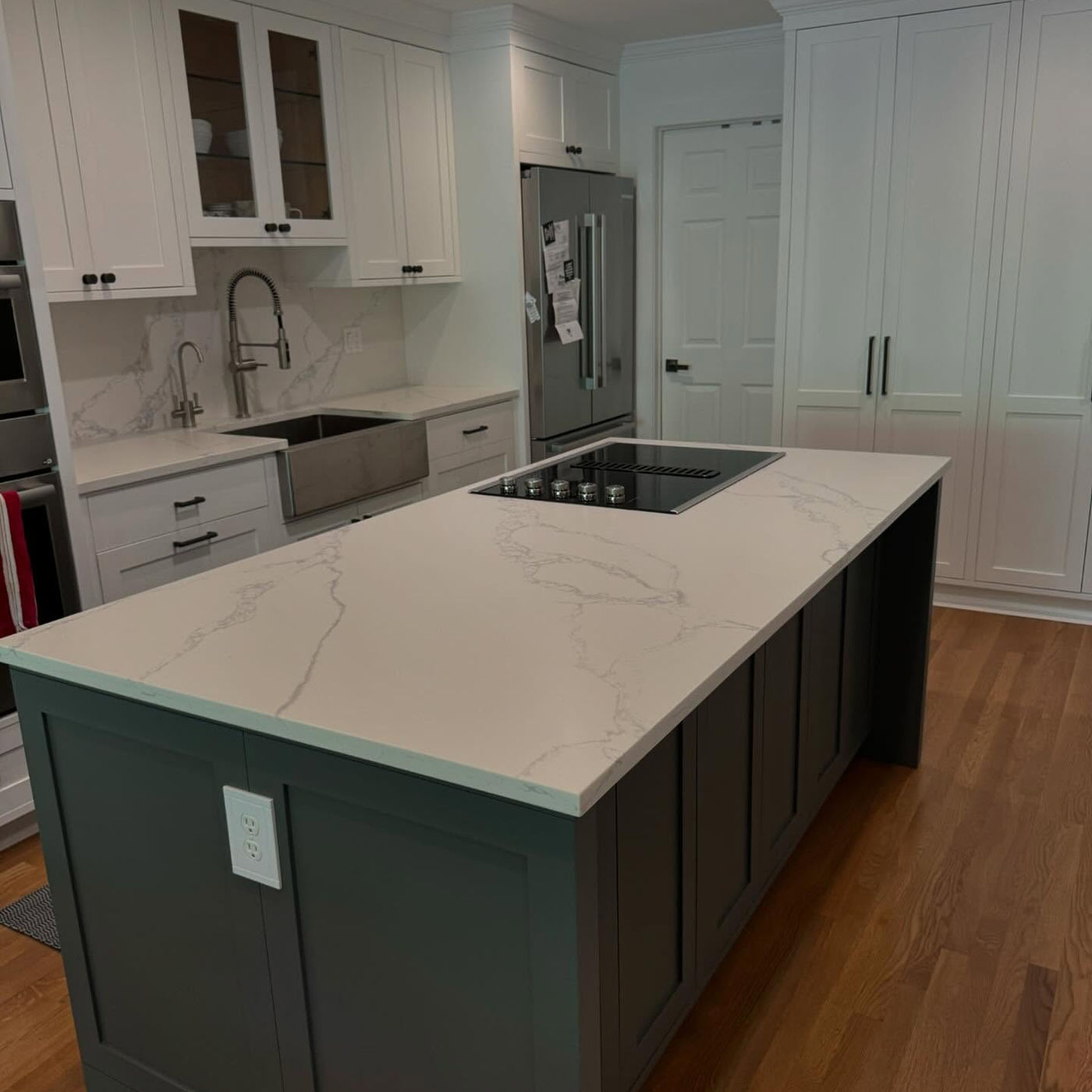 Honed quartz, soft matte against dark base. Calacatta Quartz with StoneGuard Satin film in Jersey City, NJ