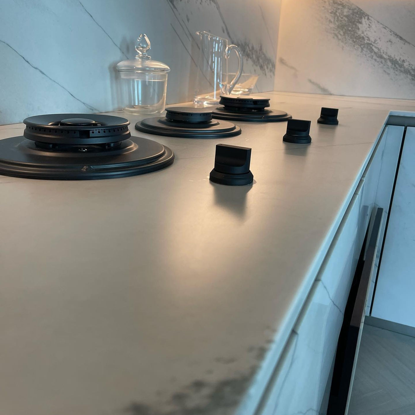 Cooktop counter, burners set into the stone. Honed Marble with StoneGuard Satin film in Montclair, NJ