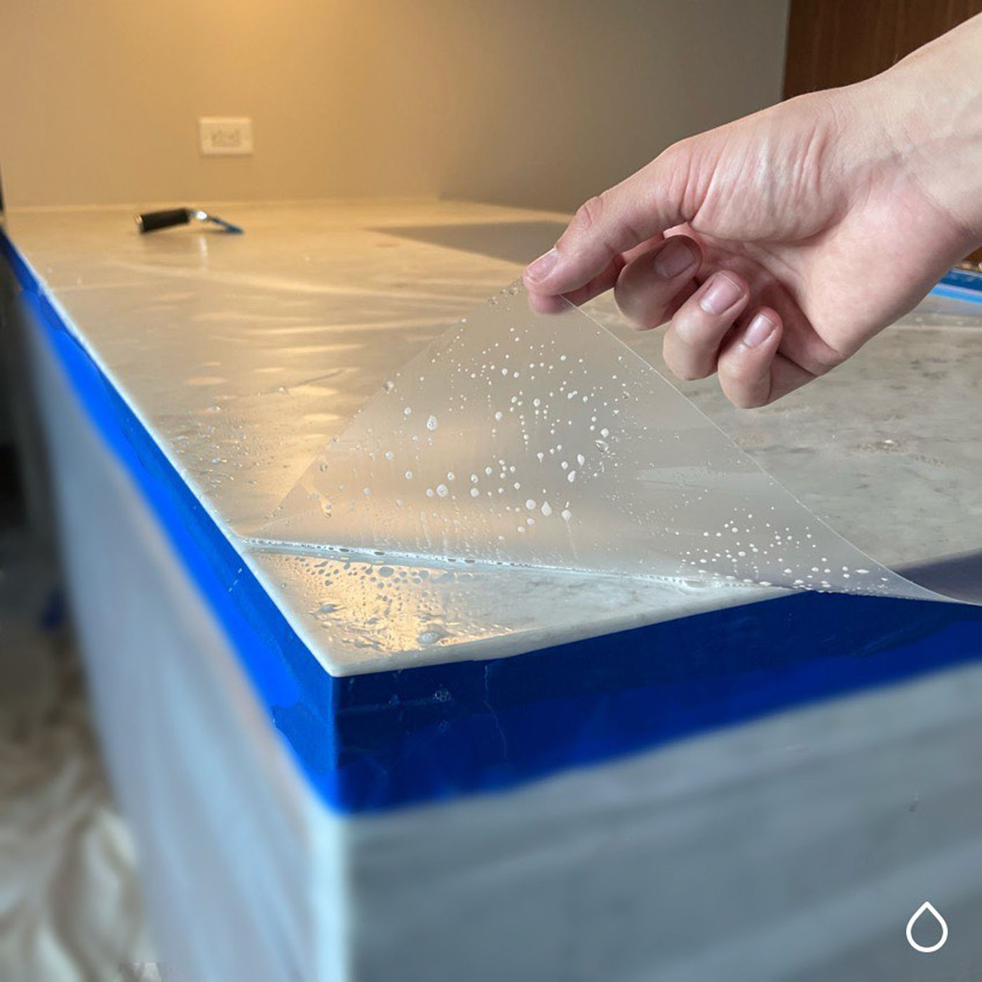 Mid-install. Hand-cut to the slab. Quartz with StoneGuard Satin film in Bergen County, NJ