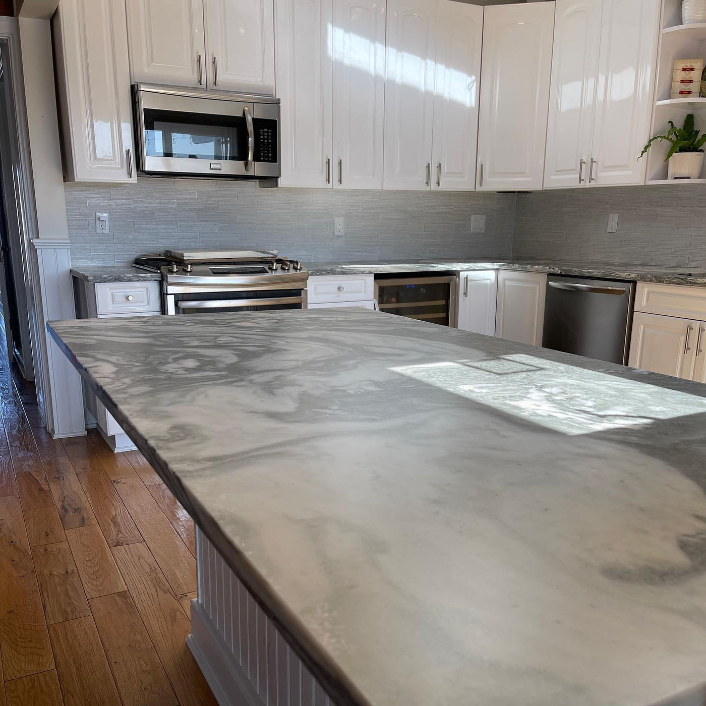 Soft grey veining, expansive island. Honed Marble with StoneGuard Satin film in Bucks County, PA
